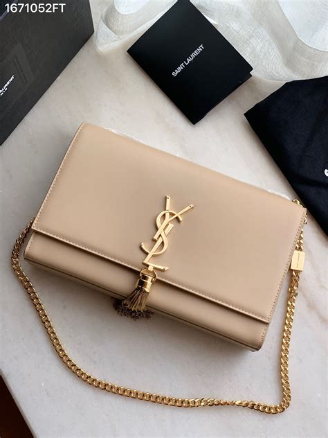 ysl tassel clutch beige|YSL tuxedo handbags.